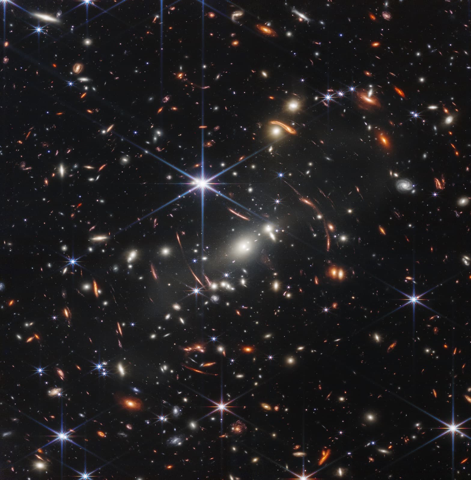 The JWST deep field: thousands of galaxies in a patch of sky the size of a grain of sand held at arm's length.